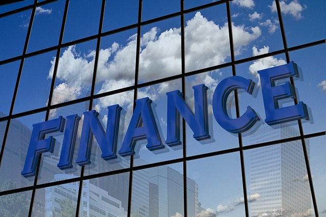 Photo of a finance sign on the side of an office building.