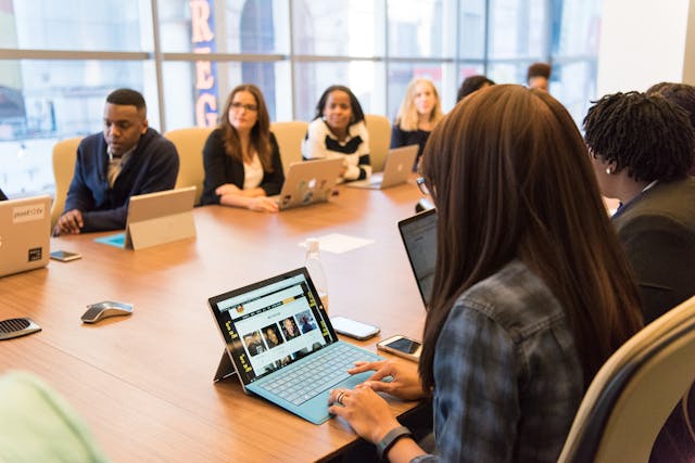 People at a business strategy meeting in a conference room.