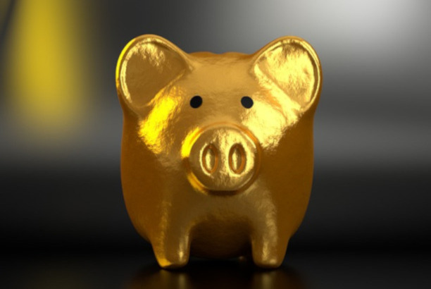 Photo of a gold piggy bank.