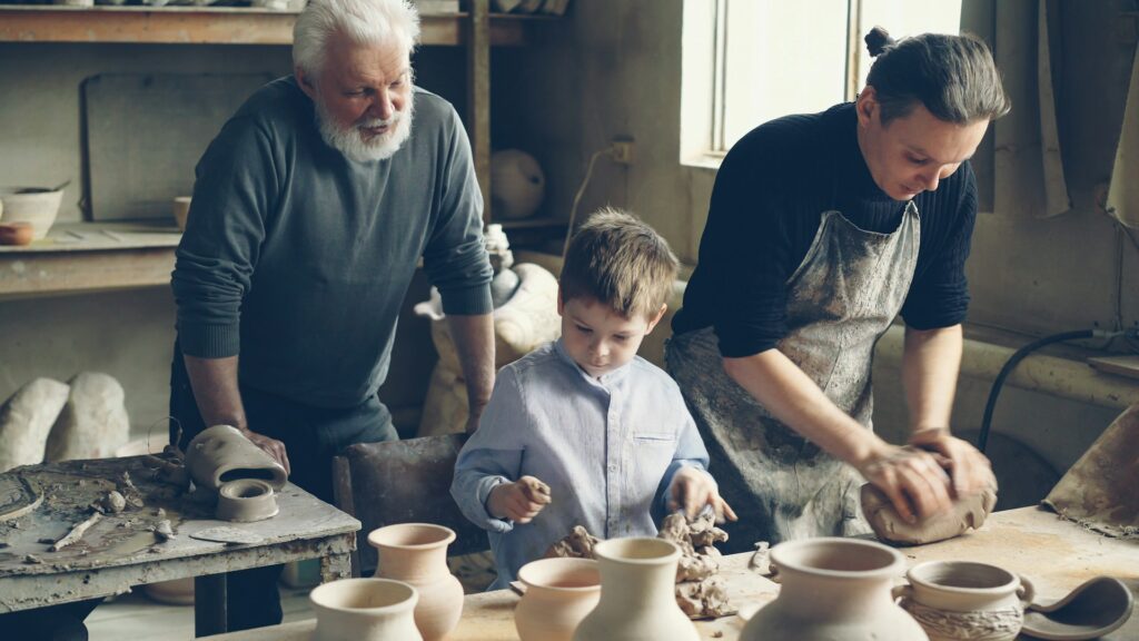 Pic of family working in their pottery shop