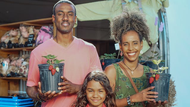 Pic of family business owners posing for camera
