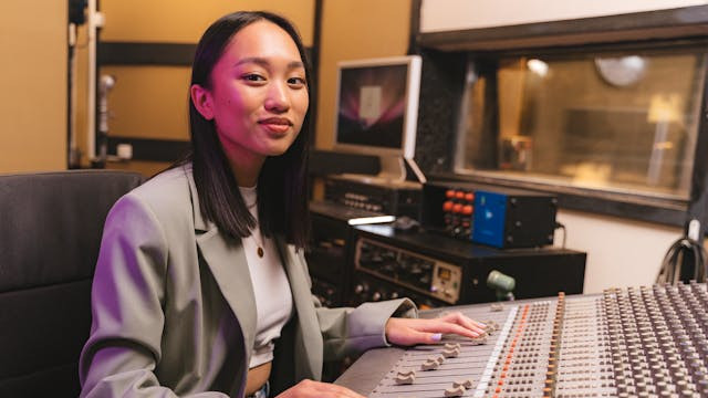 Pic of young female music engineer owner in her studio